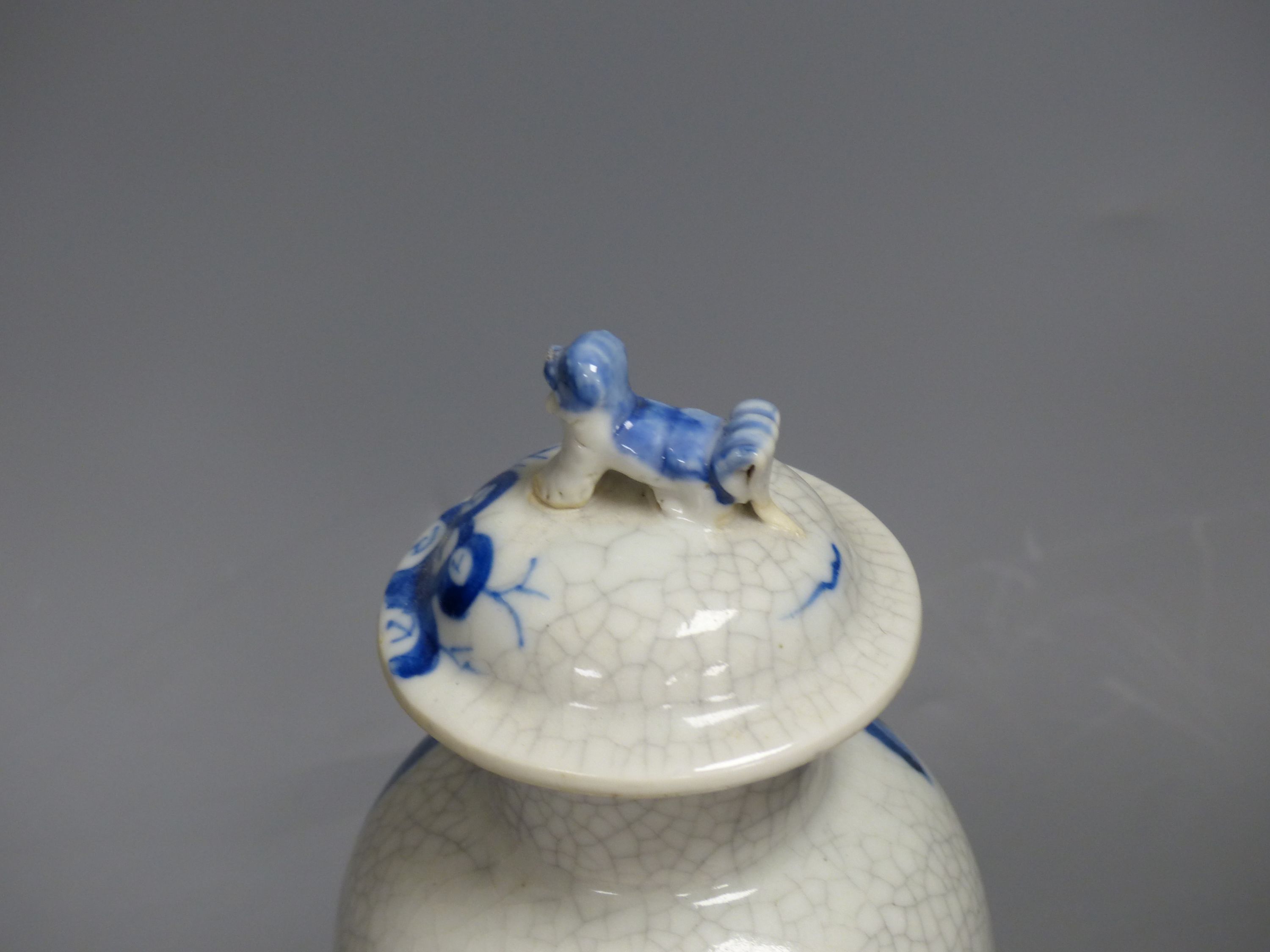 A late 19th century Chinese blue and white crackle glaze vase and cover, height 27cm